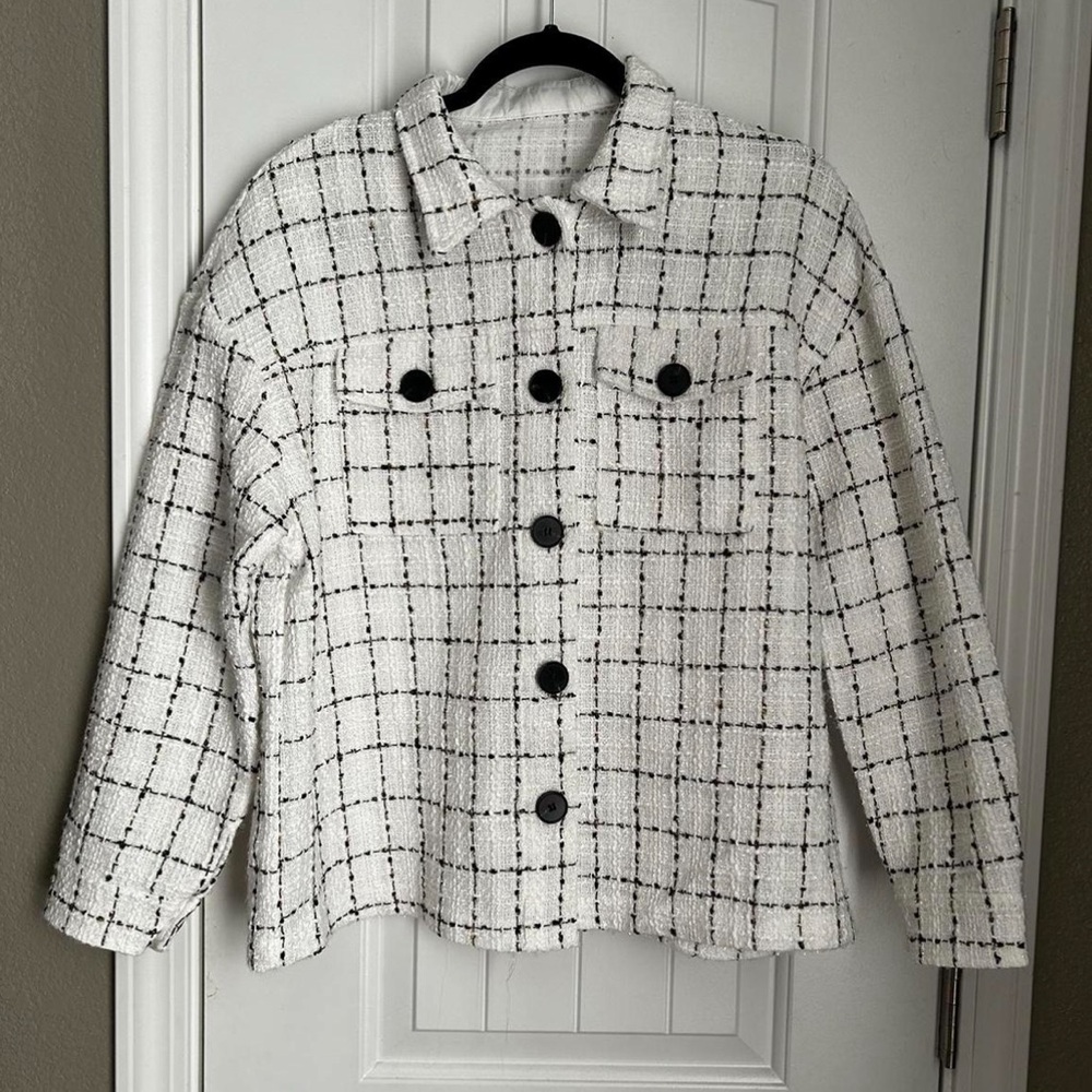 White coat with black and gold plaid design
